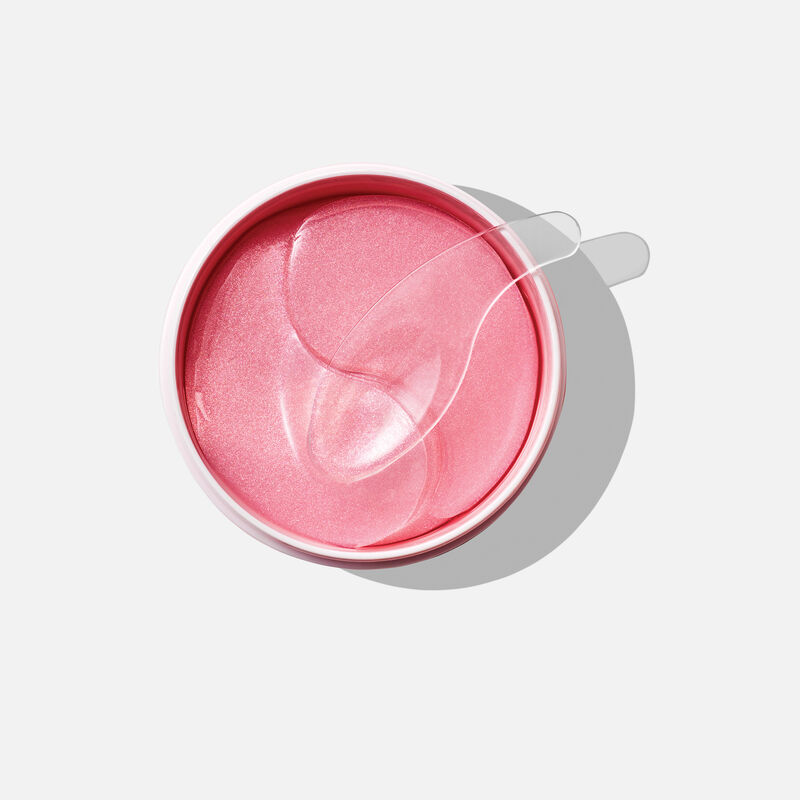 An open jar of Mary Kay Hydrogel Eye Patches with a spatula